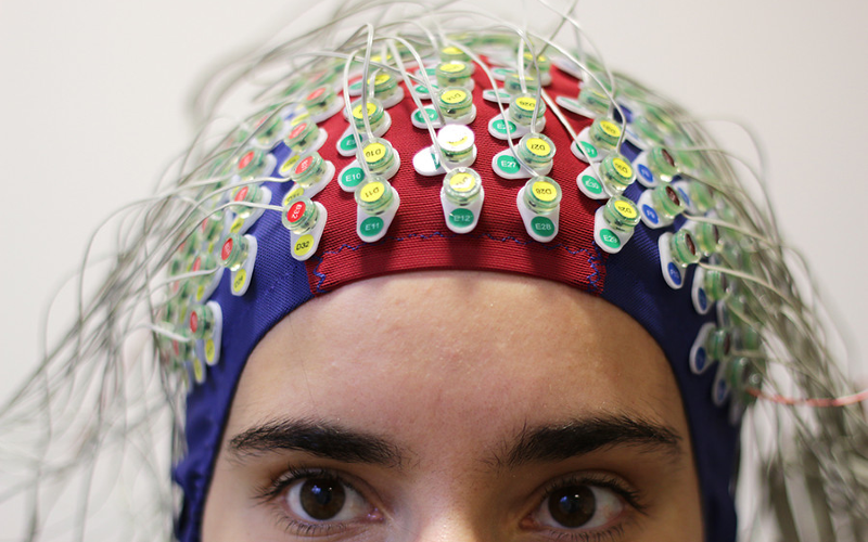 Study participant wearing ӰԺ ear institute EEG skullcap.
