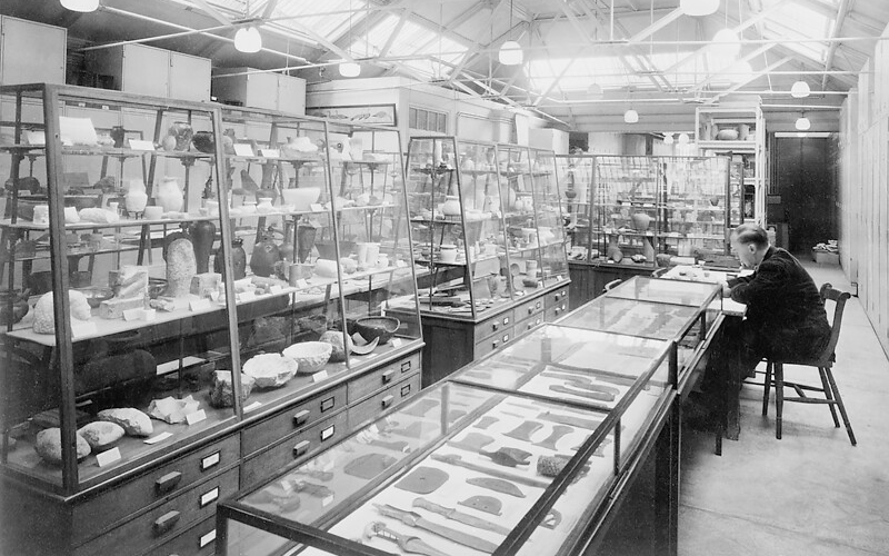 An historical photograph of a ӰԺ academic working in a museum lab.